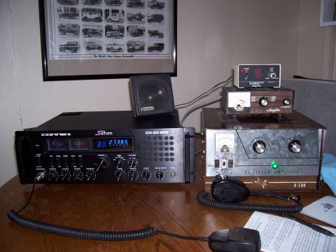 1978 Ford F-150 - A collection of CB radio equipment, including a Connex Saturn CX-33 HMR and an RF linear amplifier, is displayed on a table.