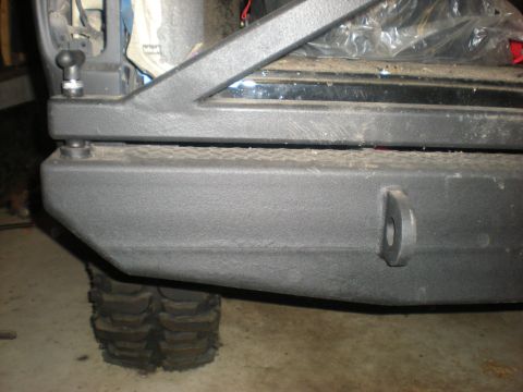 1978 Ford Bronco - Close-up of an aftermarket rear bumper and tire, likely from an off-road vehicle.