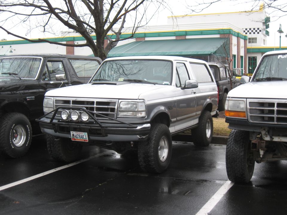 1994 Ford Bronco 3q-front view, white and grey with aftermarket bumper and lights