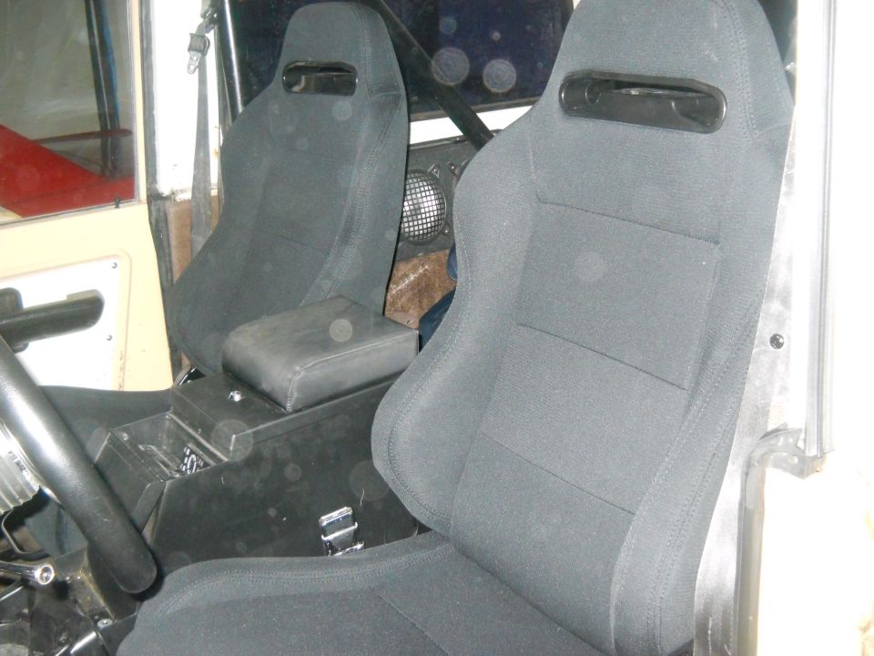 Interior view of racing seats and center console in a vehicle