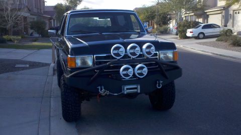 1991 Ford Bronco - This 1991 Ford Bronco is equipped with a winch and multiple auxiliary lights on its front bumper.