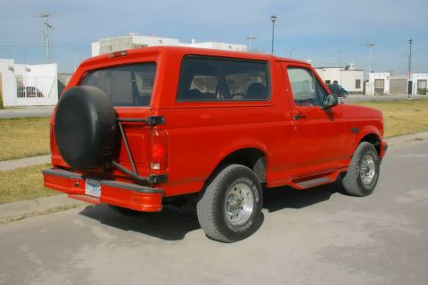 1995 Ford Bronco - This 1995 Ford Bronco is seen from the rear, a spare tire mounted externally on the tailgate.