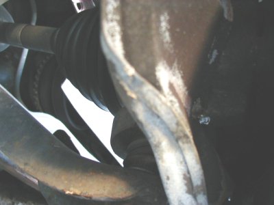 1997 Ford Taurus - This image shows a close-up view of a vehicle's CV joint and suspension components.