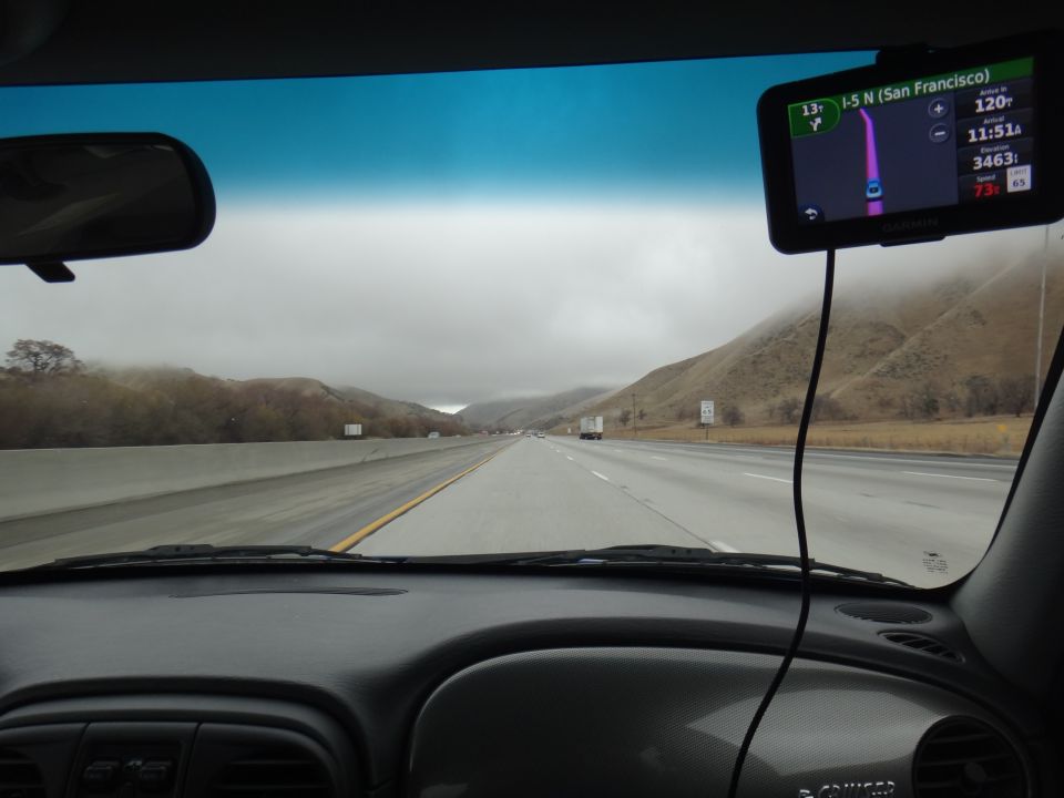 Interior view of car dashboard with GPS showing I-5 N to San Francisco