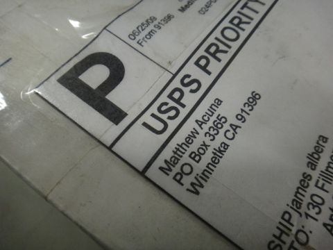1993 Ford Taurus - Close-up of a USPS Priority Mail label showing sender and recipient information.