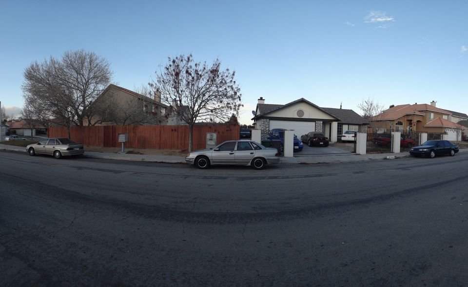 Silver 1993 Ford Taurus sedan parked curbside, side view