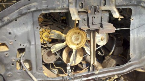 1978 Ford Bronco - Close-up view of the engine bay, focusing on the fan and belt system.
