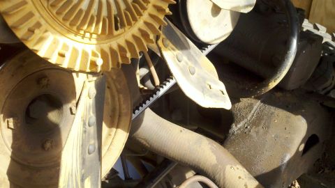 1978 Ford Bronco - Close-up view of engine fan and belts, likely part of a motor rebuild.