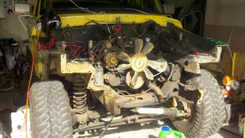 1978 Ford Bronco - Front end of a 1978 Ford Bronco disassembled for engine work.