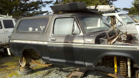 1978 Ford Bronco - This 1978 Ford Bronco is missing its wheels and hood, suggesting it is being salvaged for parts.