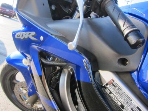 1999 Mercury Grand Marquis - Close-up of a blue motorcycle's front section, showing fairing and handlebars.