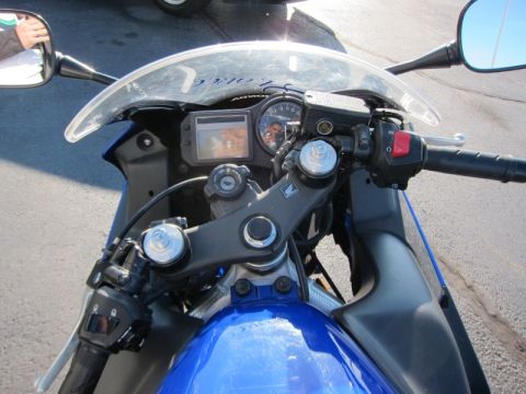 1999 Mercury Grand Marquis - Close-up view of a motorcycle's cockpit, showing the handlebars, instrument cluster, and part of the fuel tank.