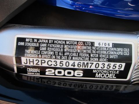 1999 Mercury Grand Marquis - Vehicle identification label with manufacturing date and VIN for a 2006 Honda CBR600F4.