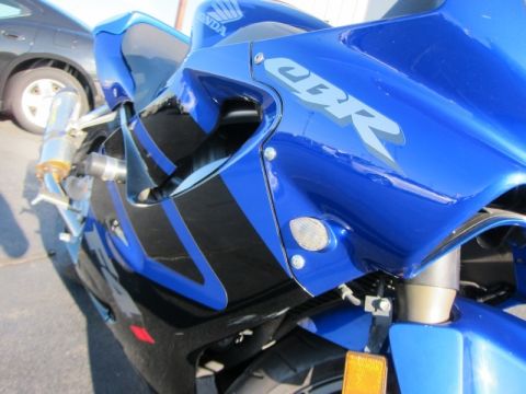 1999 Mercury Grand Marquis - Close-up of a blue Honda CBR motorcycle with black accents and CBR graphics visible.