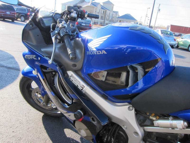 Blue Honda CBR motorcycle side view