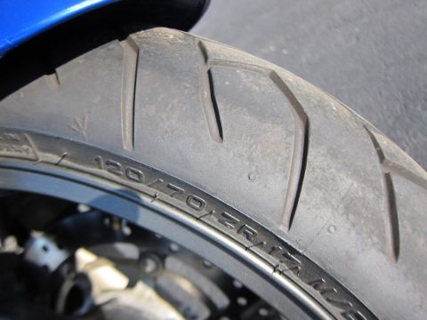 1999 Mercury Grand Marquis - Motorcycle tire detail showing size 120/70 ZR17.