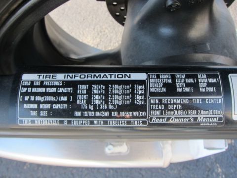 1999 Mercury Grand Marquis - Sticker details motorcycle tire information including pressures, sizes, and brands like Bridgestone and Michelin.