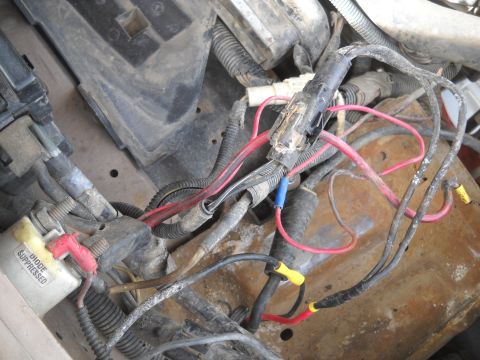 1992 Ford Explorer - Close-up view of a vehicle's engine wiring harness, showing various wires and connectors.
