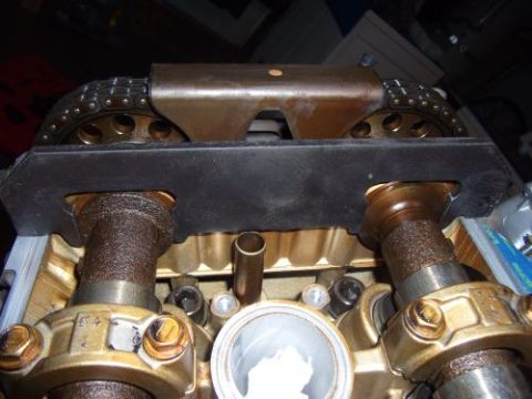 1991 Ford Taurus - Close-up view of engine timing components, showing camshafts and a timing chain.