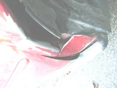 1997 Ford Taurus - This photo shows a damaged car bumper, not a 1997 Ford Taurus.