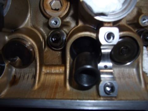 1991 Ford Taurus - This is a close-up view of an engine's cylinder head, showing internal components like valves and rocker arms.