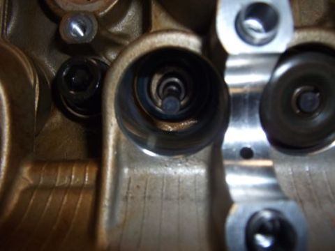 1991 Ford Taurus - Engine cylinder head detail with visible valve springs and fasteners. Supermotors.net logo present.