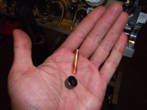 1991 Ford Taurus - Close-up of a hand holding engine parts, with a Supermotors.net watermark visible.