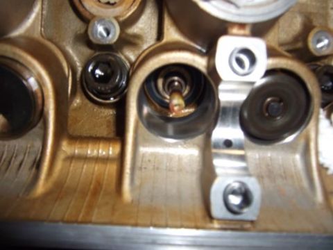 1991 Ford Taurus - Engine cylinder head detail, showing internal components and oil staining.