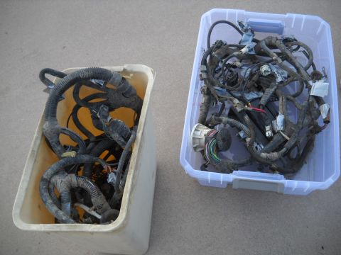 1992 Ford Explorer - Two bins contain a tangled mess of automotive wiring harnesses, likely for parts or repair.