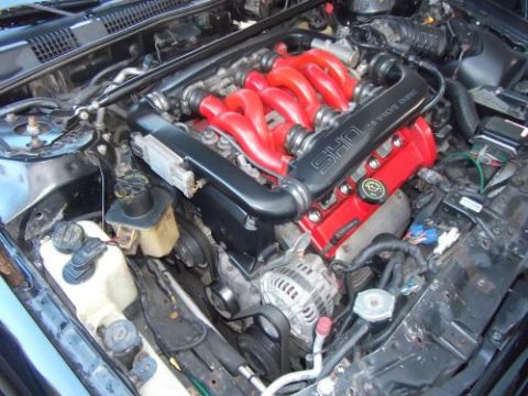 1991 Ford Taurus - Engine bay details with visible SHO branding on the intake manifold.