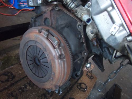 Engine and clutch assembly with rusty flywheel