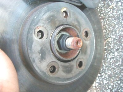 1997 Ford Taurus - This is a close-up view of a vehicle's wheel hub and brake rotor assembly.