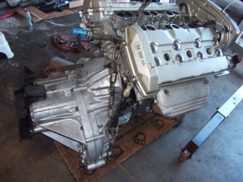 1991 Ford Taurus - Engine and transmission assembly, possibly for an engine swap, with visible part numbers.