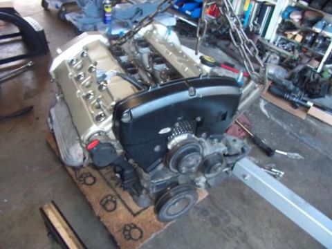 1991 Ford Taurus - Engine assembly being worked on, possibly for an engine swap.