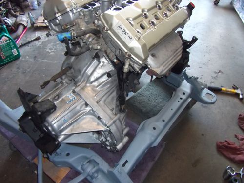 Engine and transmission assembly with part number XA 950 AA visible