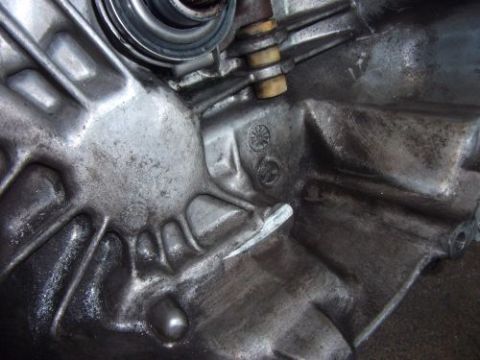 1991 Ford Taurus - This image shows a detailed view of a metal engine part, likely from a transmission or engine block.