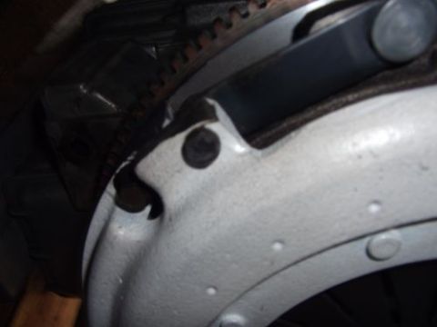 1991 Ford Taurus - Close-up of a clutch assembly and flywheel, with SuperMotors.net logo visible.