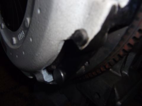 1991 Ford Taurus - A close-up view of an engine component, possibly part of a transmission or clutch assembly, with a ribbed belt visible.