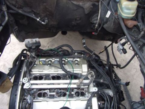 1991 Ford Taurus - Engine bay with engine components and wiring, SuperMotors.net logo visible.