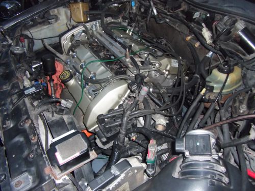 Engine bay with complex wiring and engine components