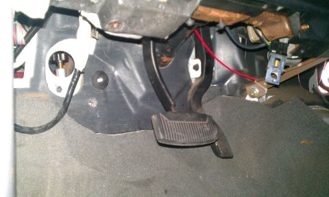 1992 Ford Ranger - Interior view of the footwell in a 1992 Ford Ranger, highlighting the pedals and surrounding components.