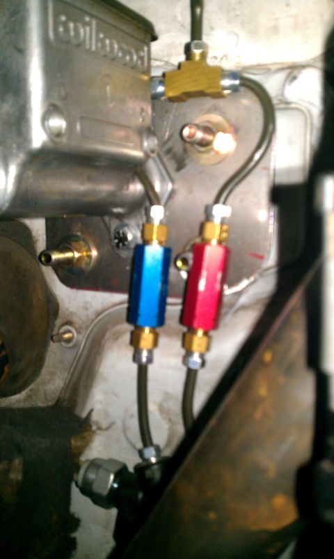 1992 Ford Ranger - Close-up of a custom brake system with a Wilwood master cylinder and inline filters.