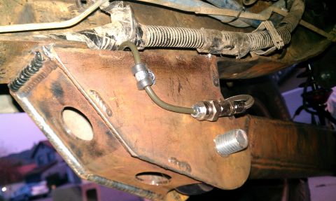 1992 Ford Ranger - Custom bracket with brake line fitting welded to vehicle frame, likely for a cab swap modification.
