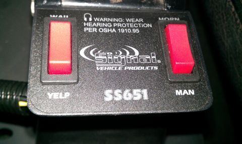 1992 Ford Ranger - Signal Vehicle Products SS651 siren switch box with WAIL, YELP, HORN, and MAN buttons and an OSHA hearing protection warning.