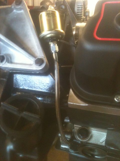 1993 Ford Bronco - Engine part with a brass fitting and braided hose is visible in the engine bay.