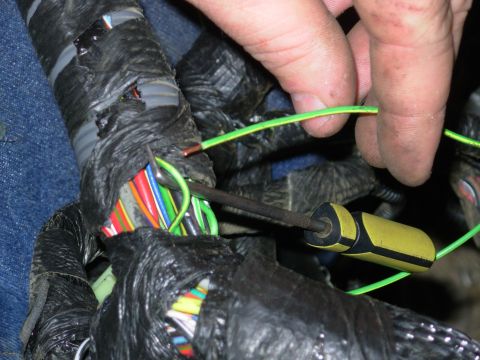 1983 Ford Bronco - After carefully tracing the wires, & re-checking a few times, I cut away the feed to the engine bay light, and pulled it back thru the harn…