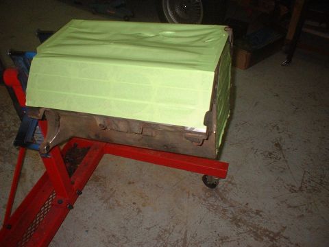 1969 Mercury Cyclone - An engine block is taped and mounted on a red stand.