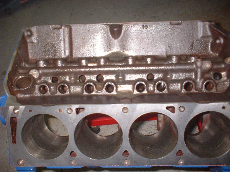 Engine block with cylinders visible, some casting marks on top