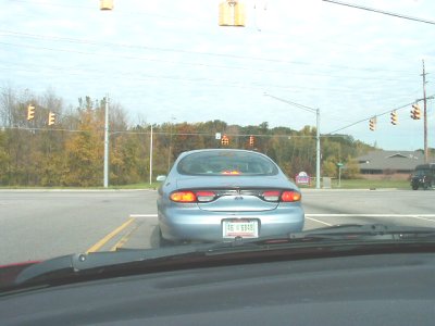 1997 Ford Taurus - Rear view of a 1997 Ford Taurus at a traffic light, license plate AB 6348.