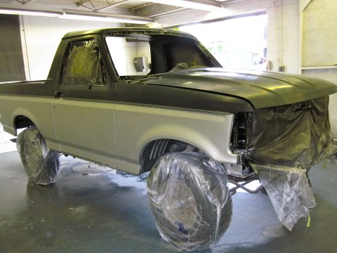 1992 Ford Bronco - This Ford Bronco is being prepped for paint, with its wheels and front end covered.